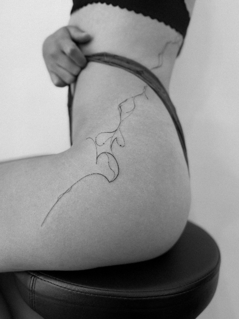 Minimal Abstract Fine Line Tattoo on the Hip
