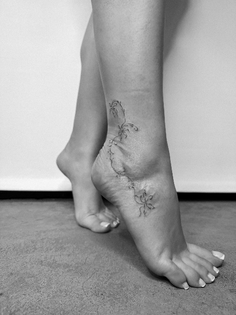 Fine Line Floral Flow Tattoo on the Ankle