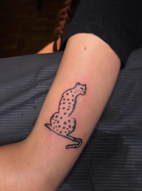 Fresh cheetah arm tattoo