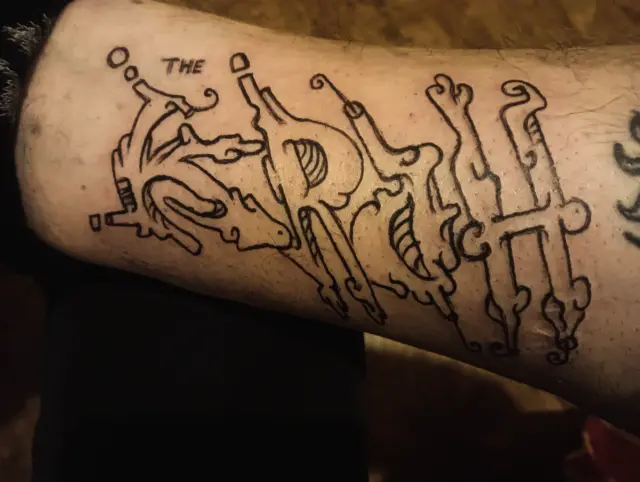Fine line illustrative graffiti tag style tattoo black